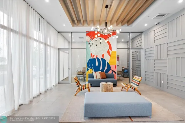 a dining room filled with furniture and a chandelier