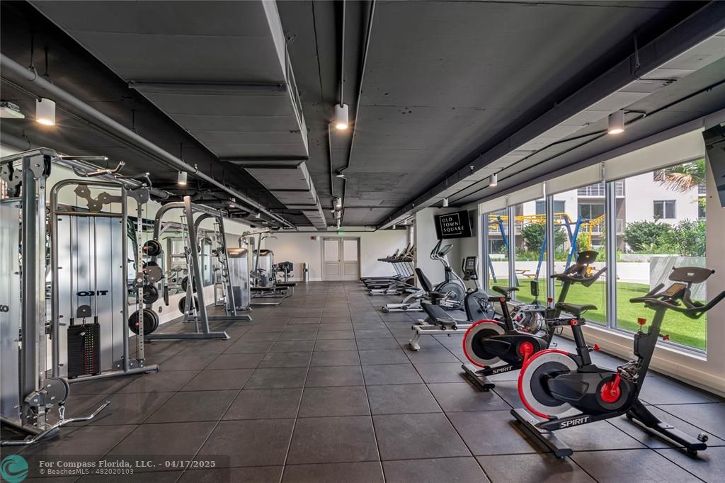 200 Northeast 1st Avenue, Unit 213 Pompano Beach, FL 33060 - Photo 7 of 23 a view of a room with gym equipment