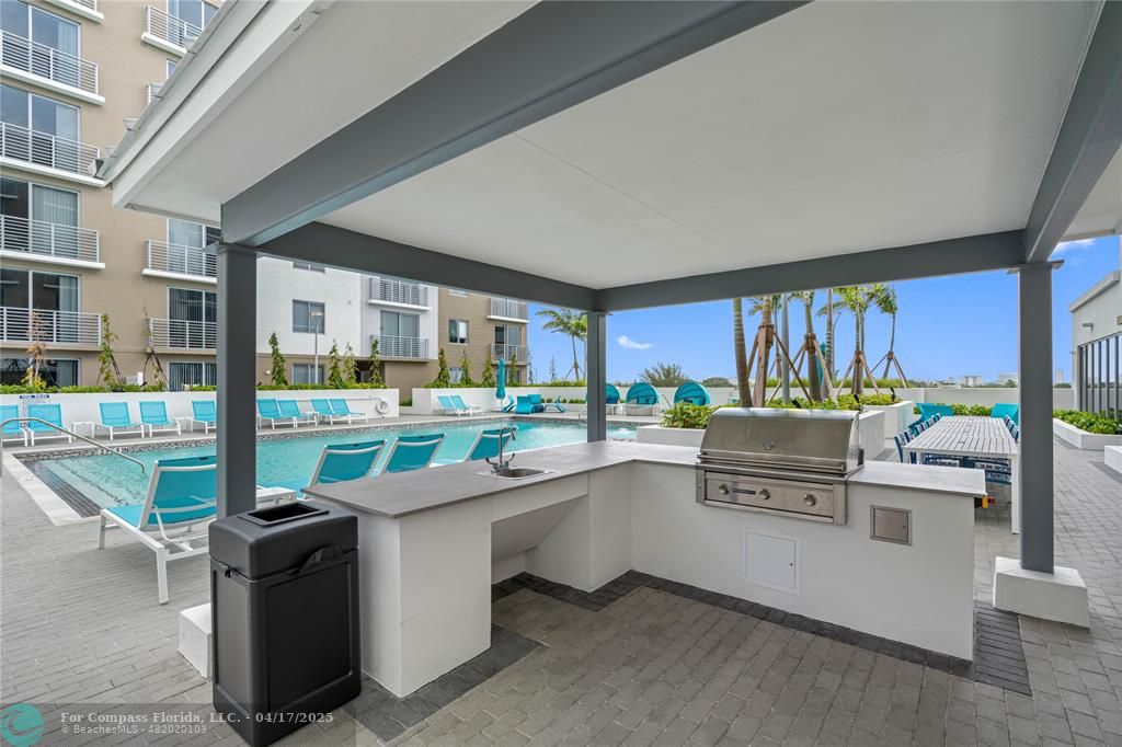 200 Northeast 1st Avenue, Unit 213 Pompano Beach, FL 33060 - Photo 9 of 23 a kitchen with counter top space