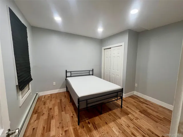 a room with wooden floor and furniture