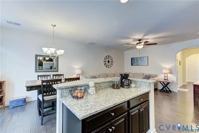 a kitchen with a counter space a sink and cabinets