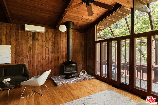 a view of a livingroom with furniture and window