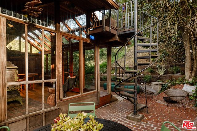 a view of a chairs and table in the patio