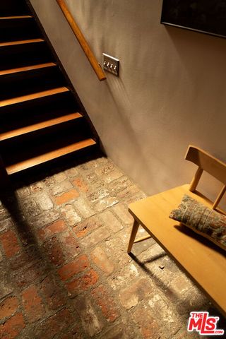 a view of staircase and a living room