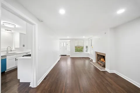 a view of a kitchen cabinets and wooden floor