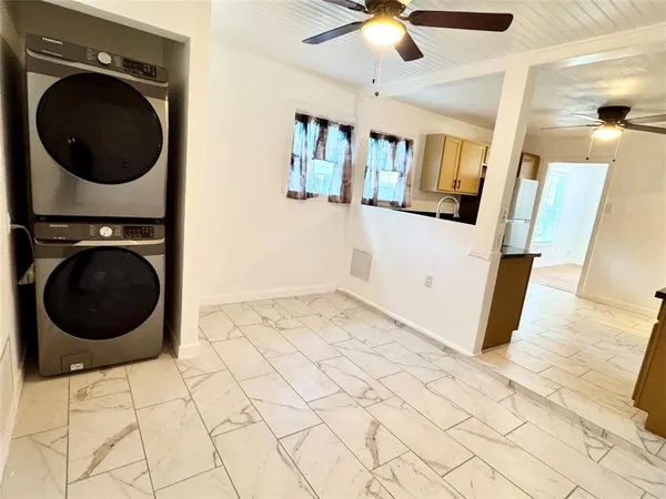 a view of a hallway with washer and dryer