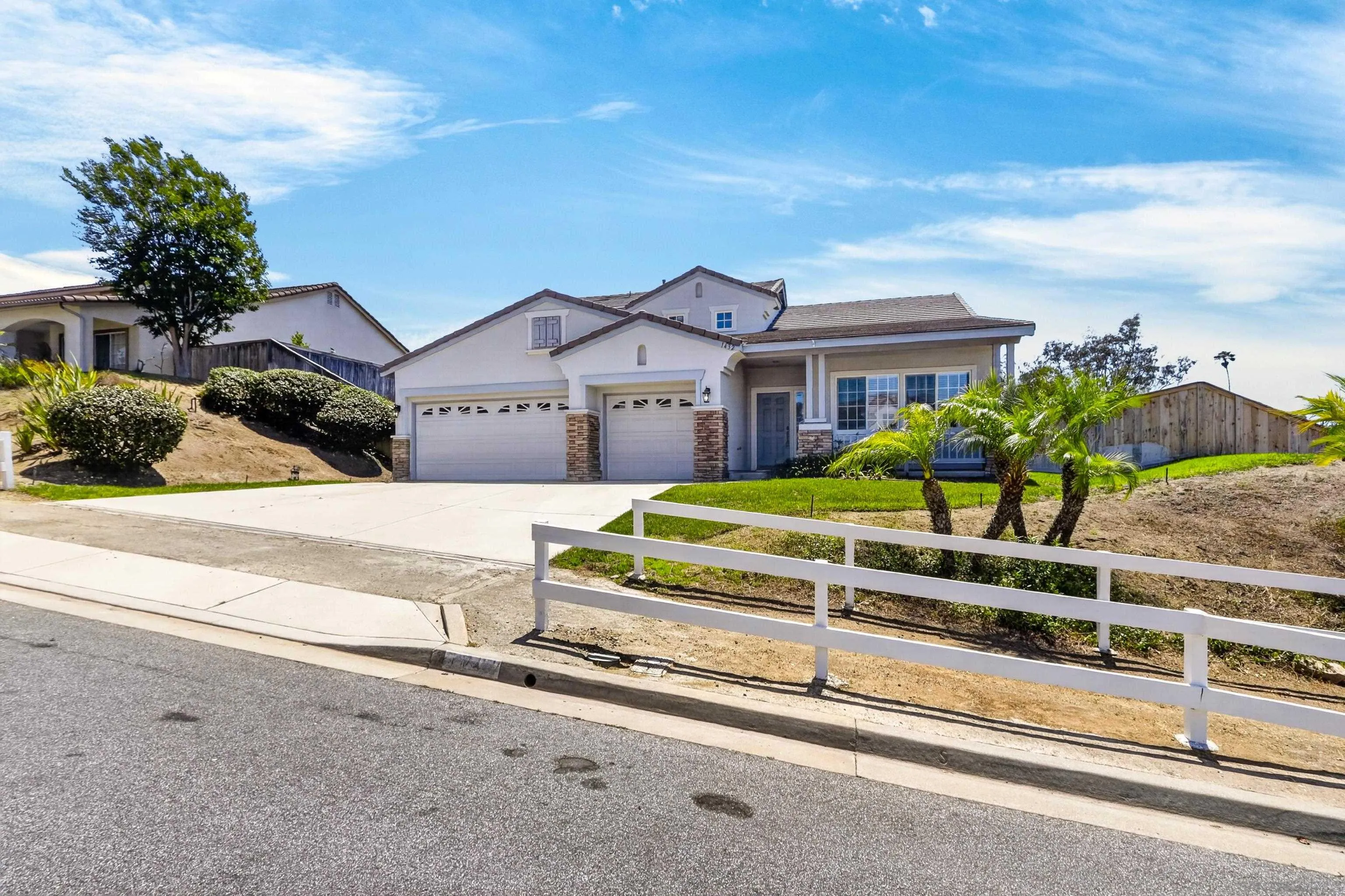 1432 Belmont Park Road Oceanside, CA 92057 - Photo 3 of 54 a front view of a house with a garden