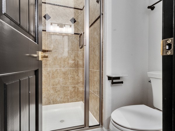 2523 Watts Street Houston, TX 77030 - Photo 28 of 45 a bathroom with a toilet and a shower