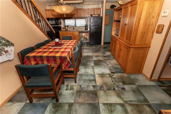 a bathroom with a sink a toilet and shower curtain