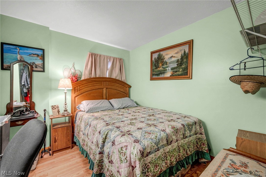 3830 Jerusalem Road Vermilion, OH 44089 - Photo 19 of 49 Bedroom featuring wood finished floors