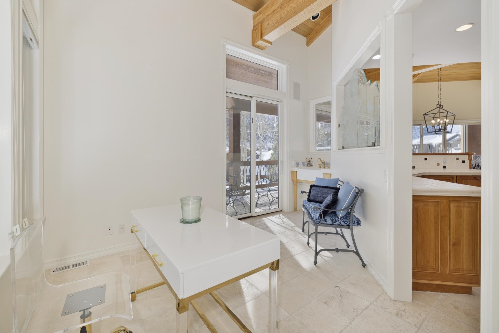 370 Ranch Road Mammoth Lakes, CA 93546 - Photo 12 of 46 Home office featuring plenty of natural light, beamed ceiling, and a chandelier