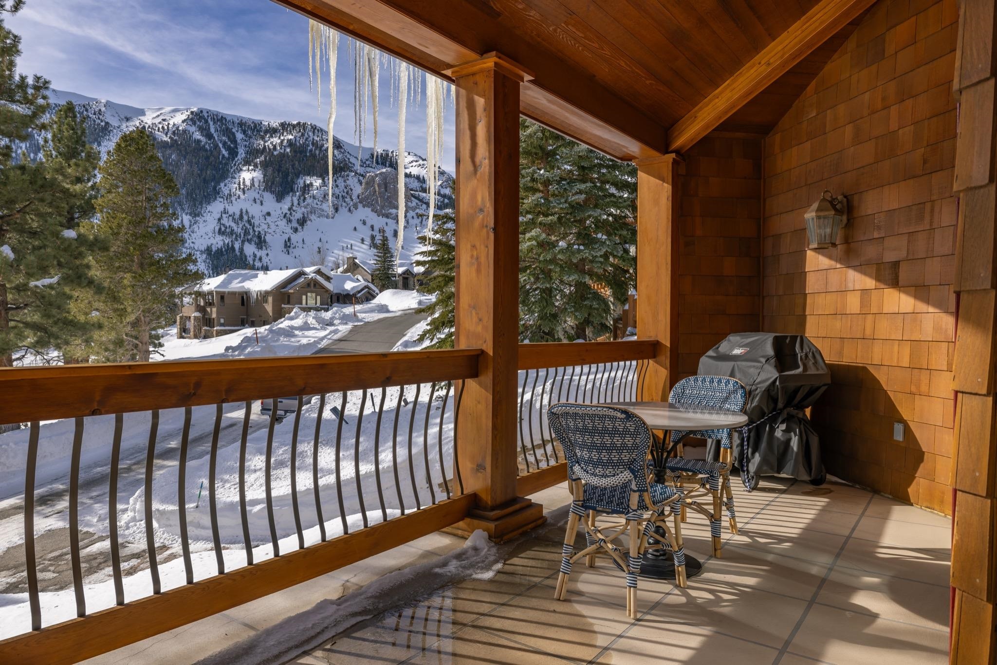 370 Ranch Road Mammoth Lakes, CA 93546 - Photo 16 of 46 Snow covered deck with a mountain view, a grill, and a balcony