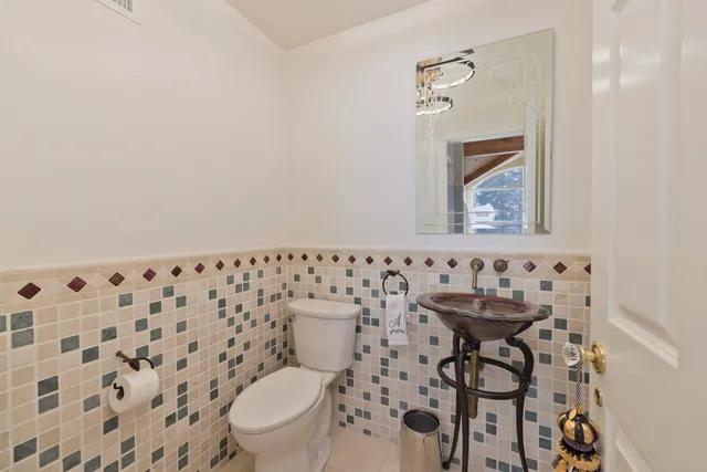 a bathroom with a toilet and a sink