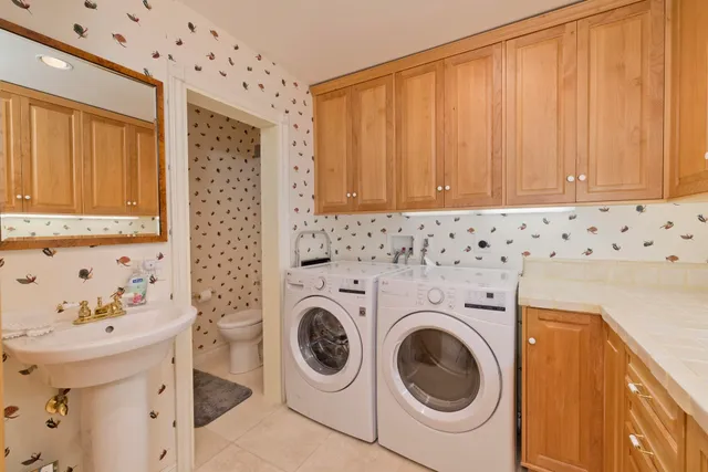 a utility room with dryer and washer