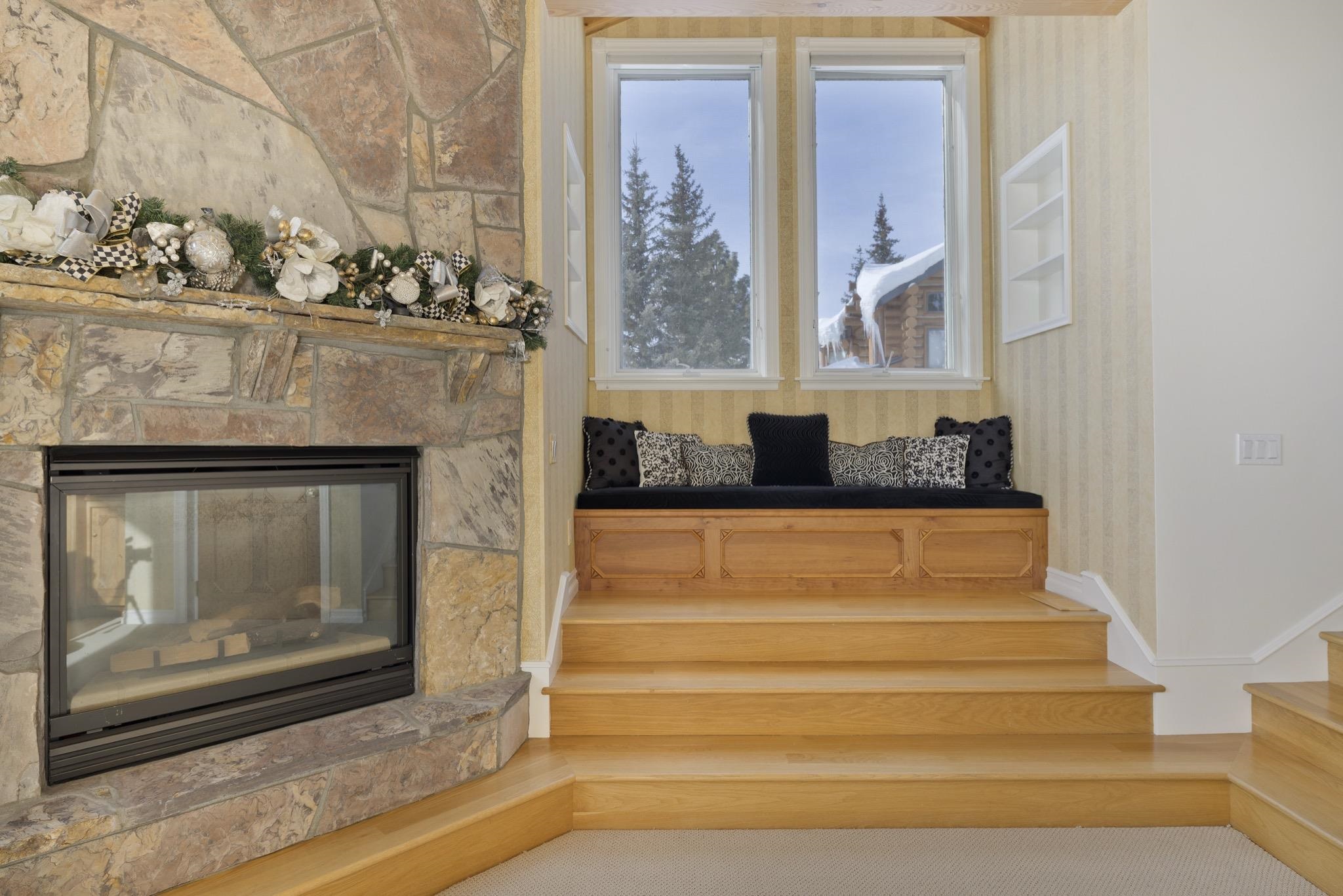 370 Ranch Road Mammoth Lakes, CA 93546 - Photo 27 of 46 Detailed view of a stone fireplace and carpet floors