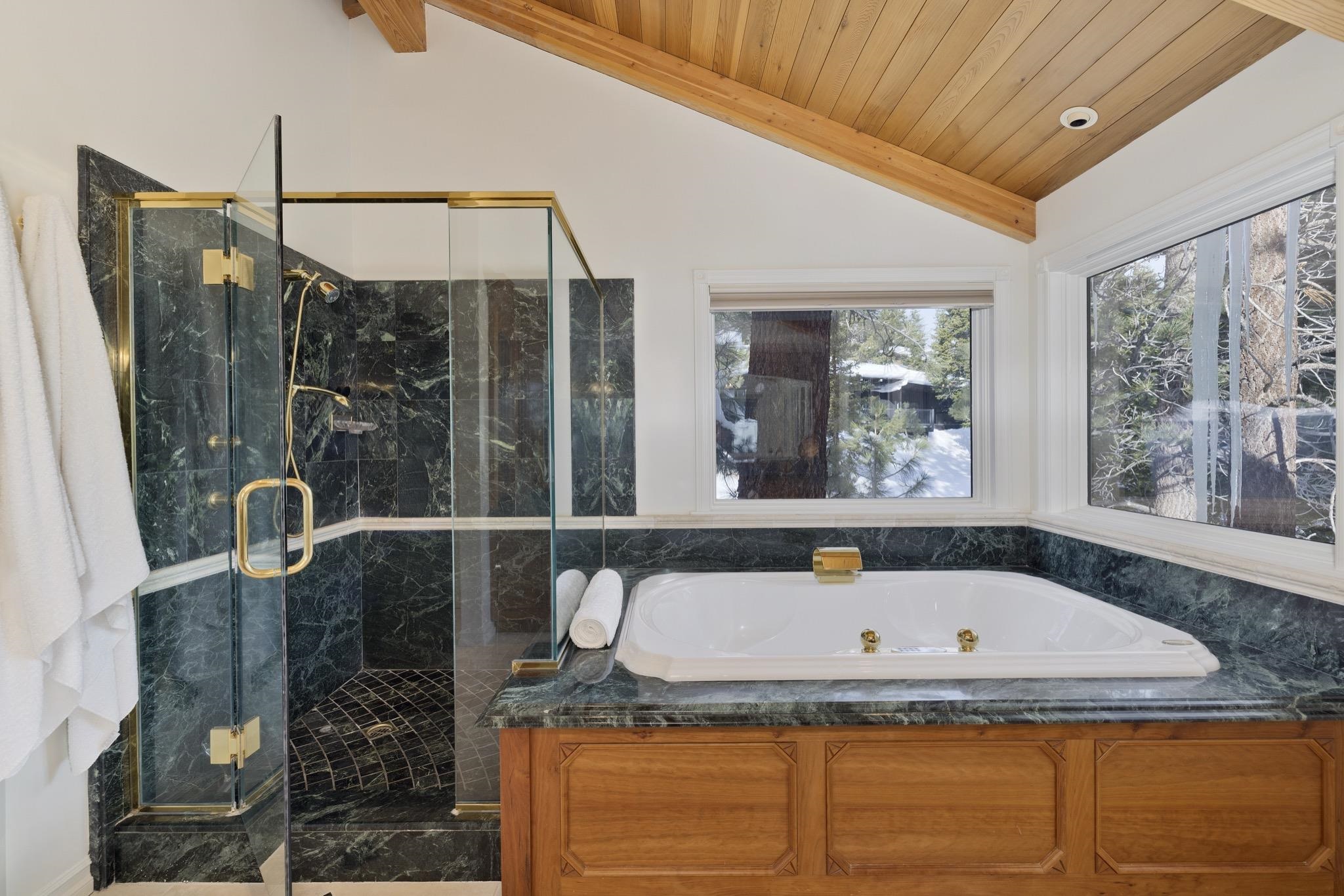370 Ranch Road Mammoth Lakes, CA 93546 - Photo 29 of 46 Bathroom with lofted ceiling, a whirlpool tub, a stall shower, and wood ceiling