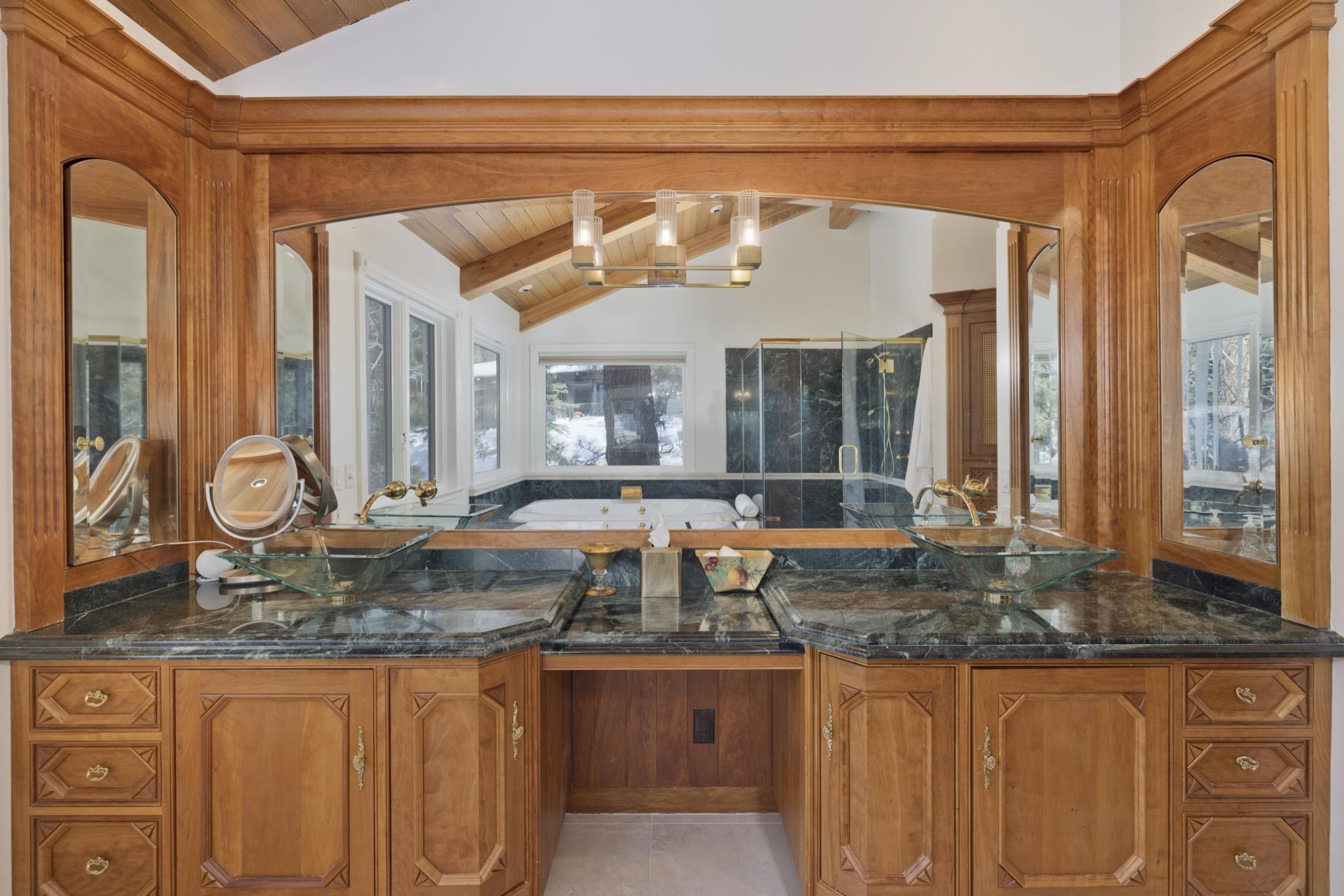 370 Ranch Road Mammoth Lakes, CA 93546 - Photo 30 of 46 Full bathroom with wooden ceiling, a shower stall, vanity, a chandelier, and light tile patterned floors
