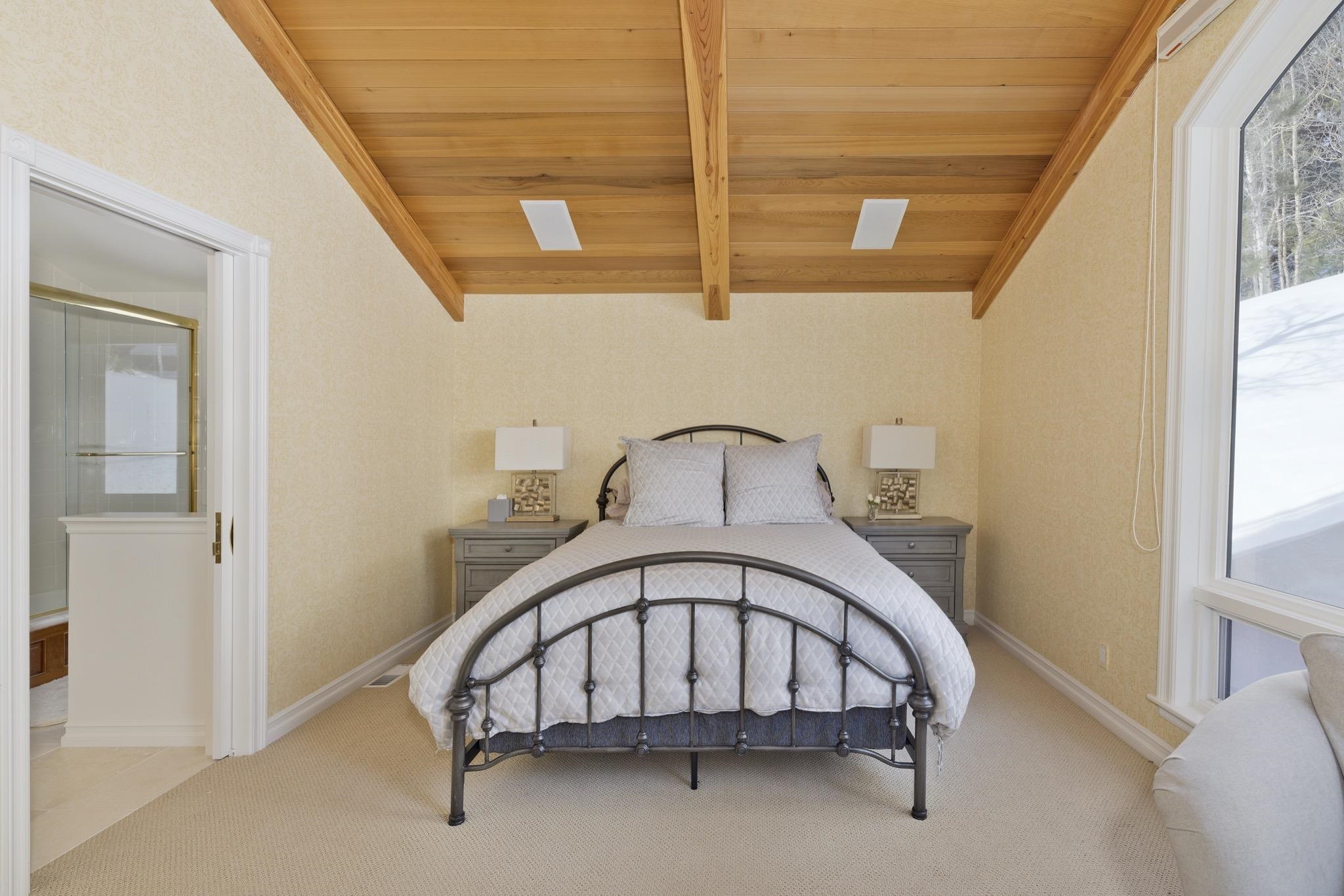 370 Ranch Road Mammoth Lakes, CA 93546 - Photo 35 of 46 Carpeted bedroom featuring multiple windows and wood ceiling