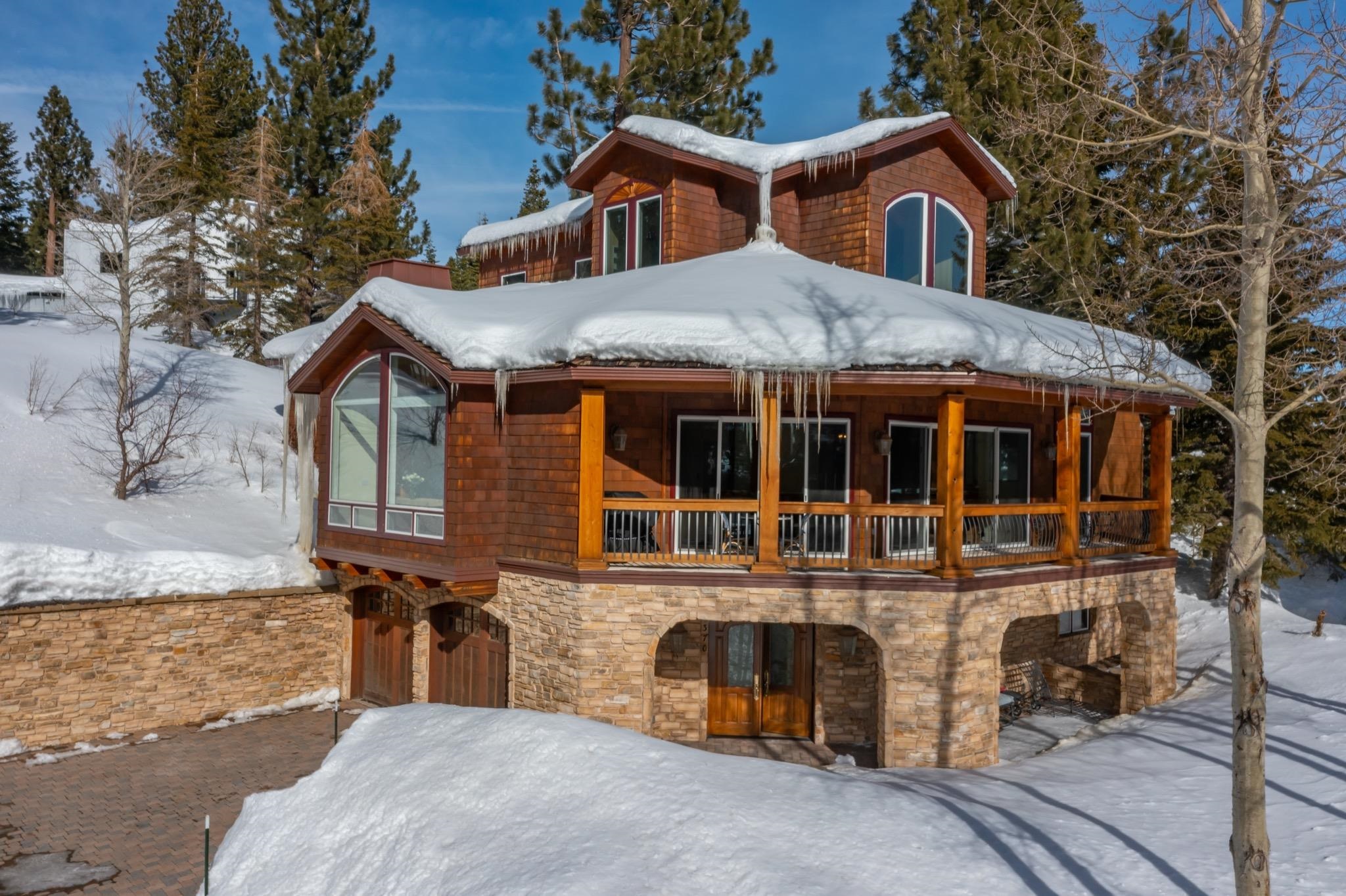 370 Ranch Road Mammoth Lakes, CA 93546 - Photo 37 of 46 Snow covered back of property with a porch and stone siding