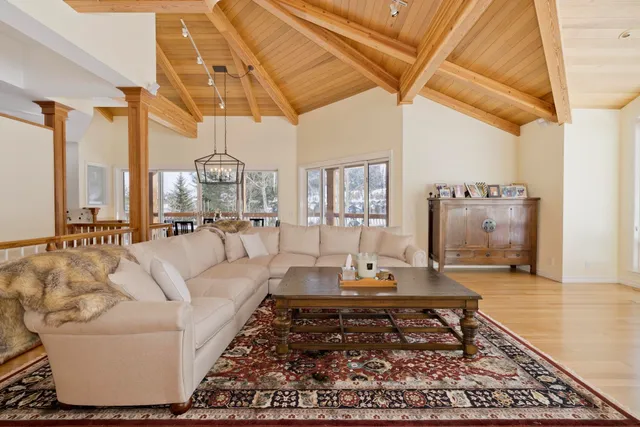 a living room with furniture and a rug