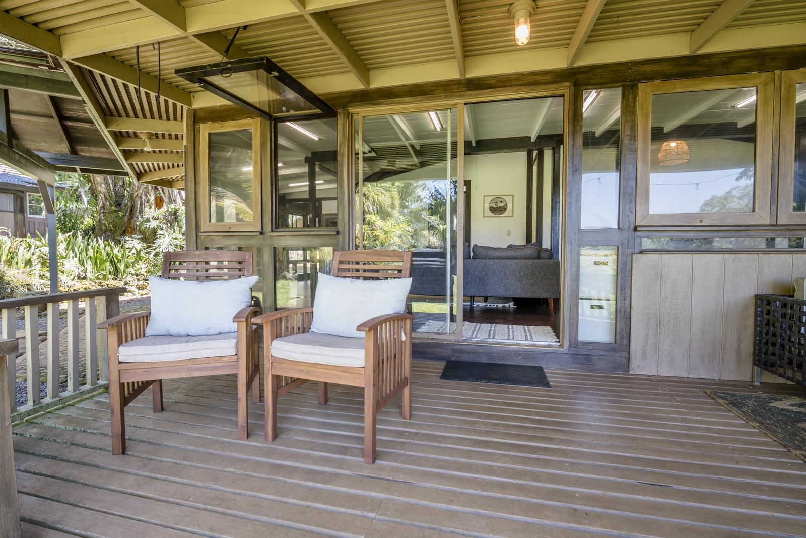 60 Lepo Place Haiku, HI 96708 - Photo 24 of 47 a view of a porch with wooden floor and outdoor seating