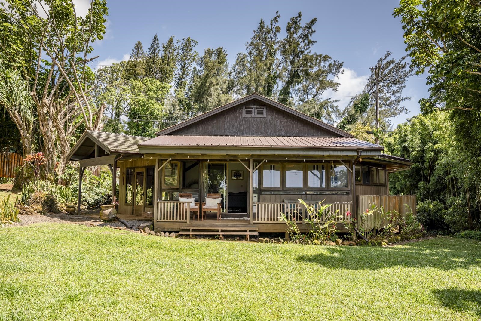 60 Lepo Place Haiku, HI 96708 - Photo 27 of 47 a front view of a house with garden