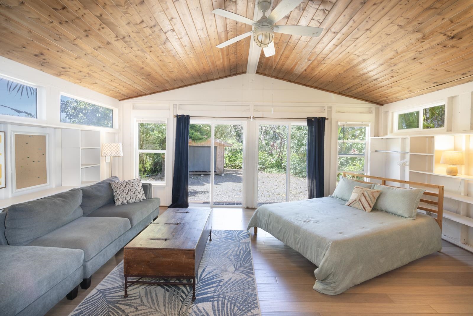 60 Lepo Place Haiku, HI 96708 - Photo 29 of 47 a bedroom with a large bed and a large window with outer view