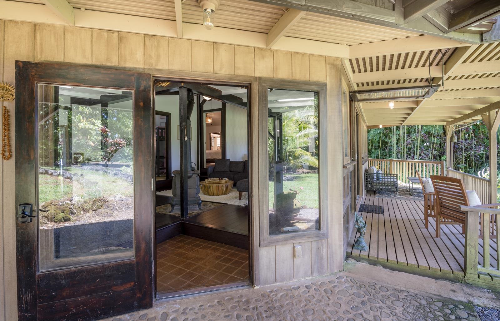 60 Lepo Place Haiku, HI 96708 - Photo 3 of 47 a view of living room and porch with furniture and floor to ceiling window