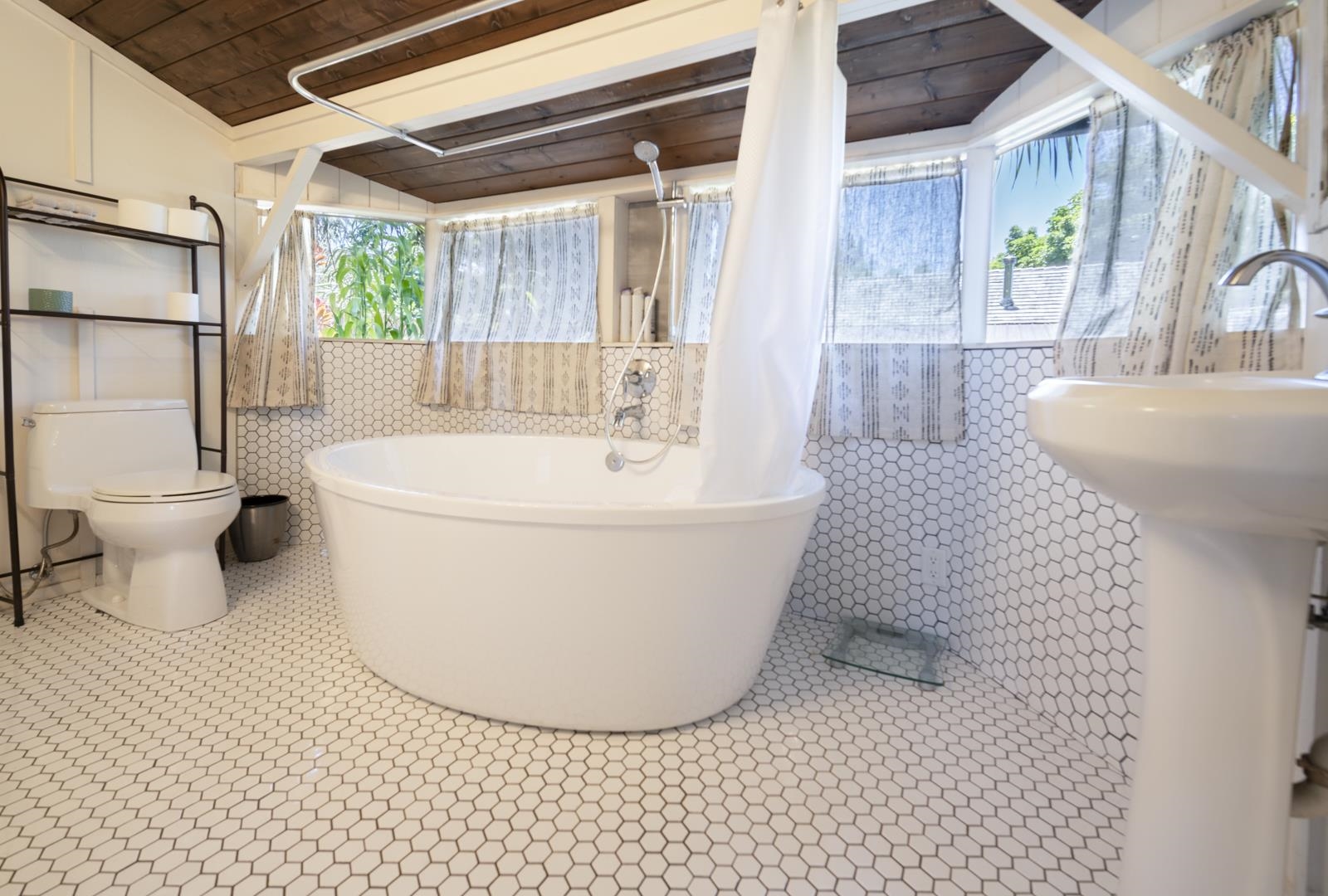 60 Lepo Place Haiku, HI 96708 - Photo 33 of 47 a white toilet sitting next to a bathroom sink