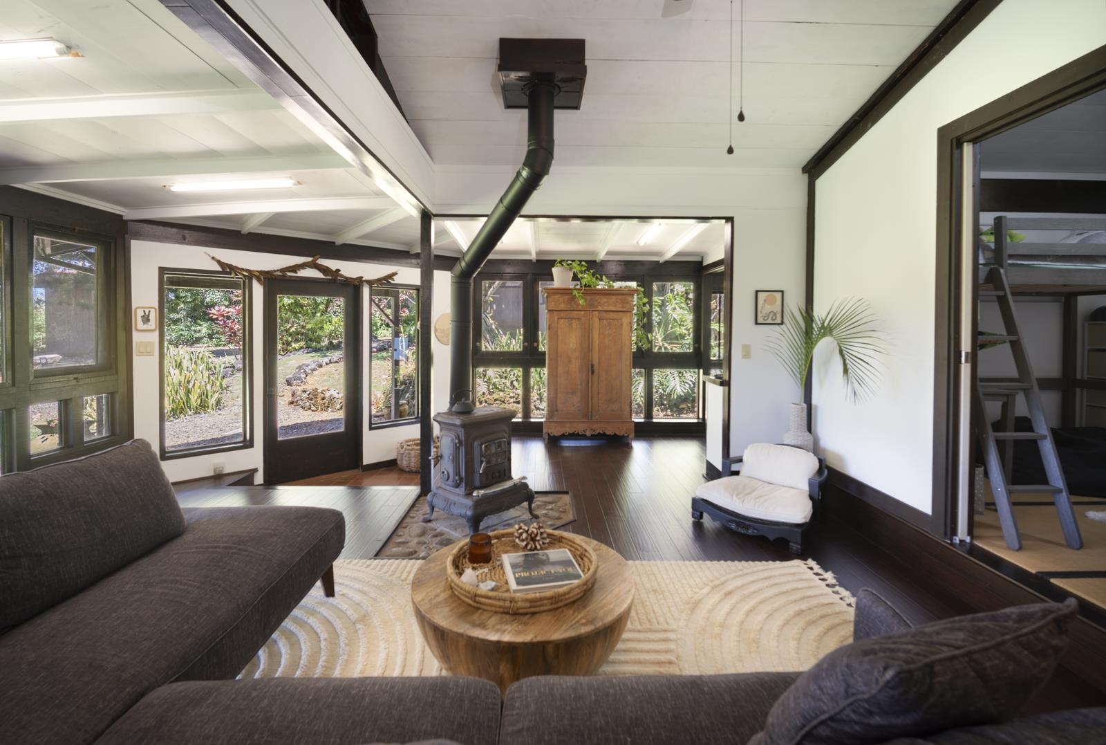 60 Lepo Place Haiku, HI 96708 - Photo 5 of 47 a living room with furniture and a wooden floor