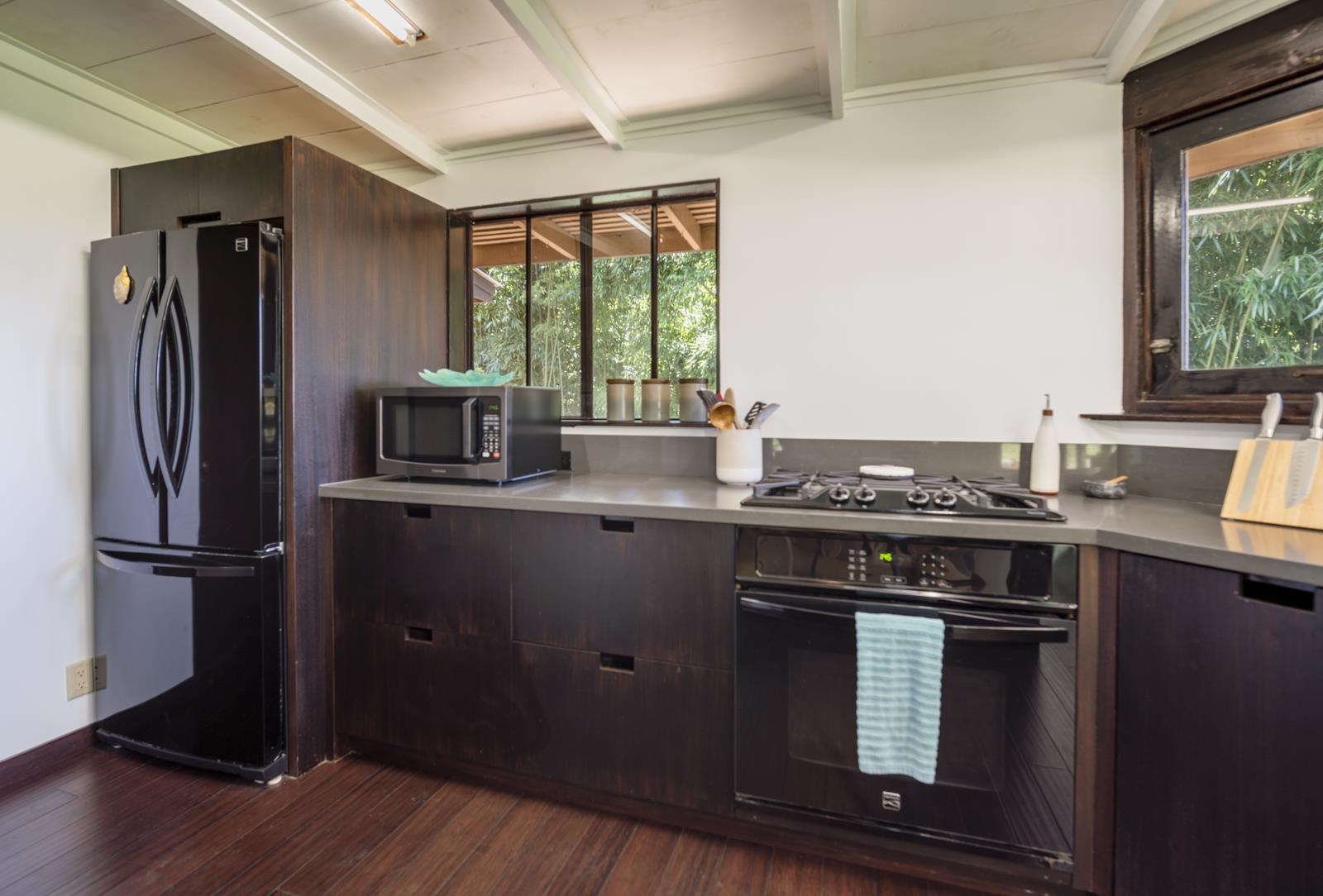 60 Lepo Place Haiku, HI 96708 - Photo 10 of 47 a kitchen with a stove and a refrigerator