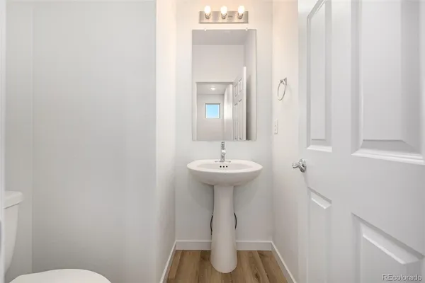 a bathroom with a sink toilet