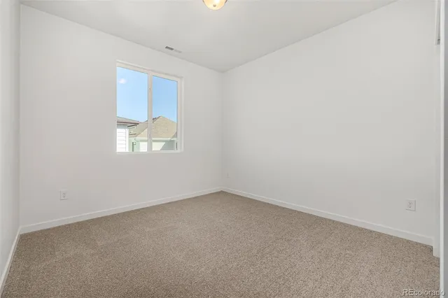 a bathroom with a toilet a sink a mirror a bathtub and vanity