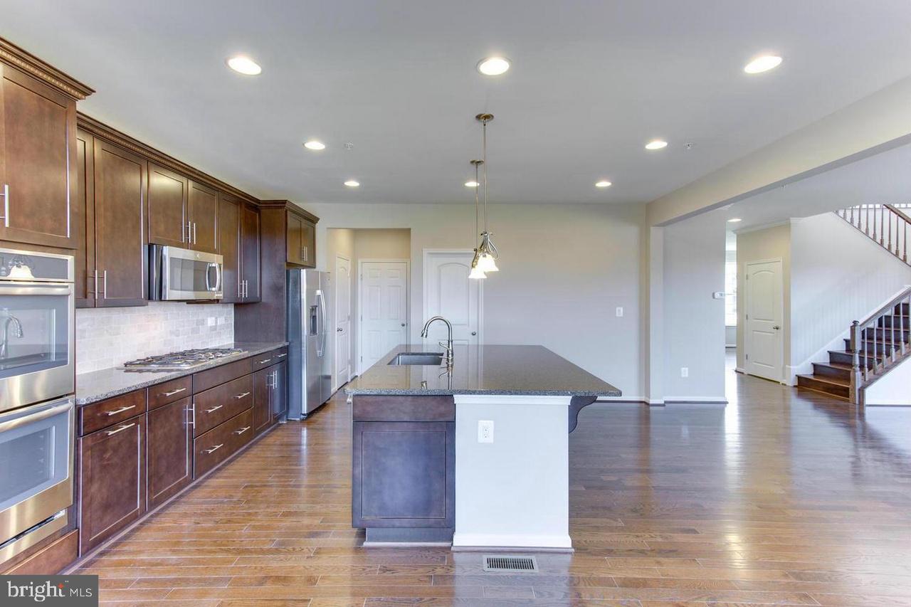 1032 Briggs Chaney Road Silver Spring, MD 20905 - Photo 14 of 30 Luxury Open Kitchen Design w/ Huge Center Island
