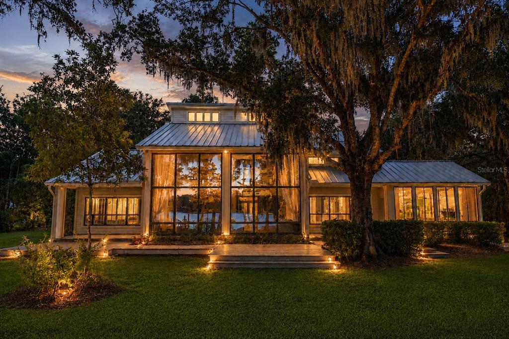 17810 Crawley Road Odessa, FL 33556 - Photo 4 of 76 a front view of a house with swimming pool having outdoor seating