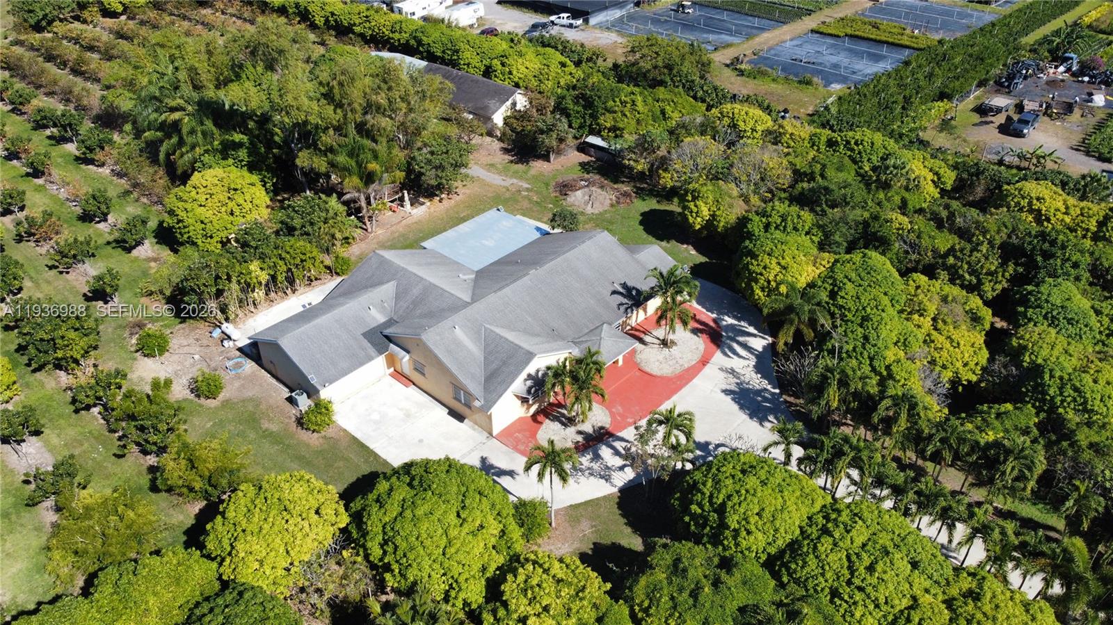 an aerial view of a house with a yard and garden