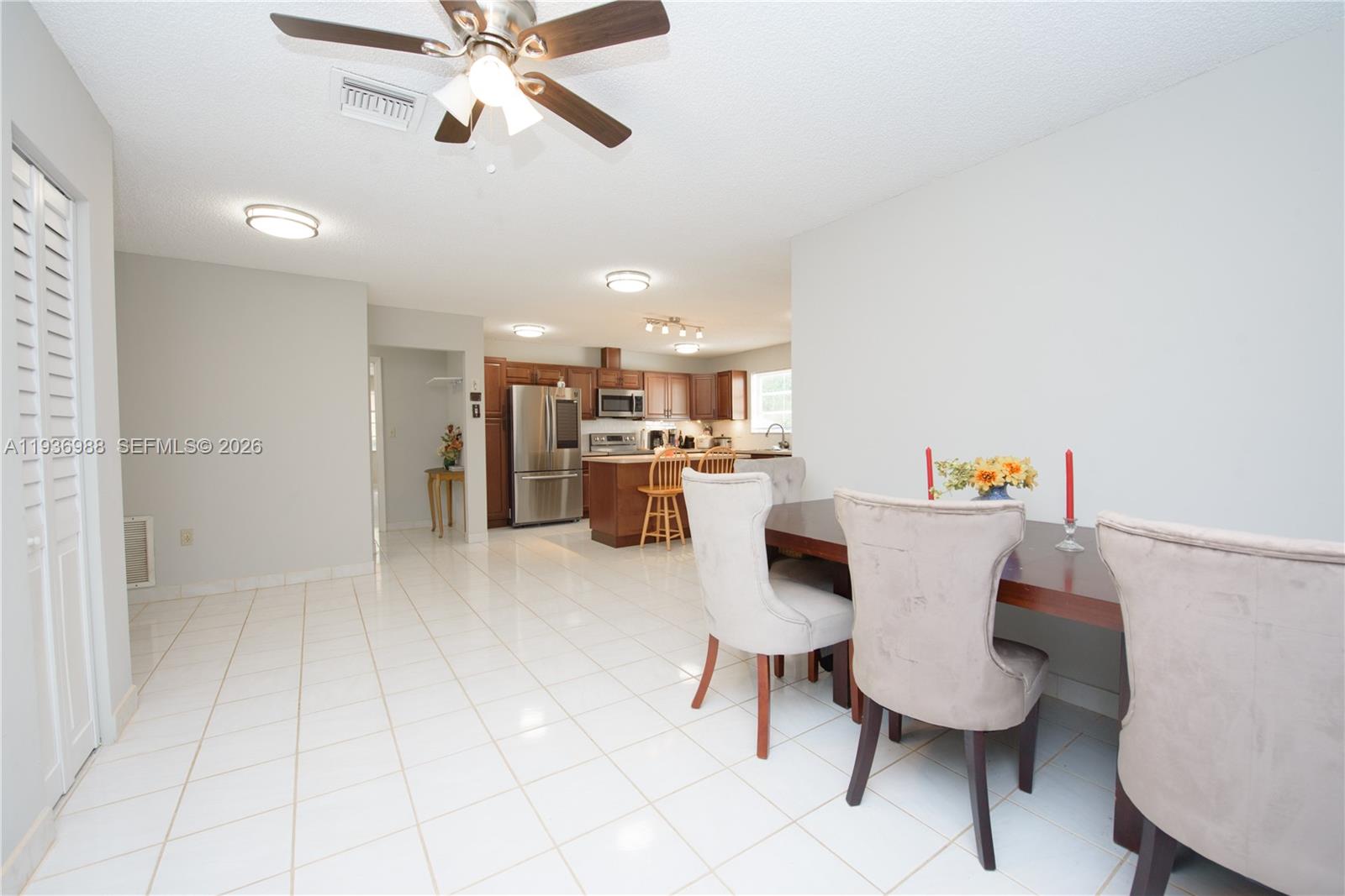21295 Southwest 376th Street Homestead, FL 33034 - Photo 11 of 51 a living room with furniture and kitchen view