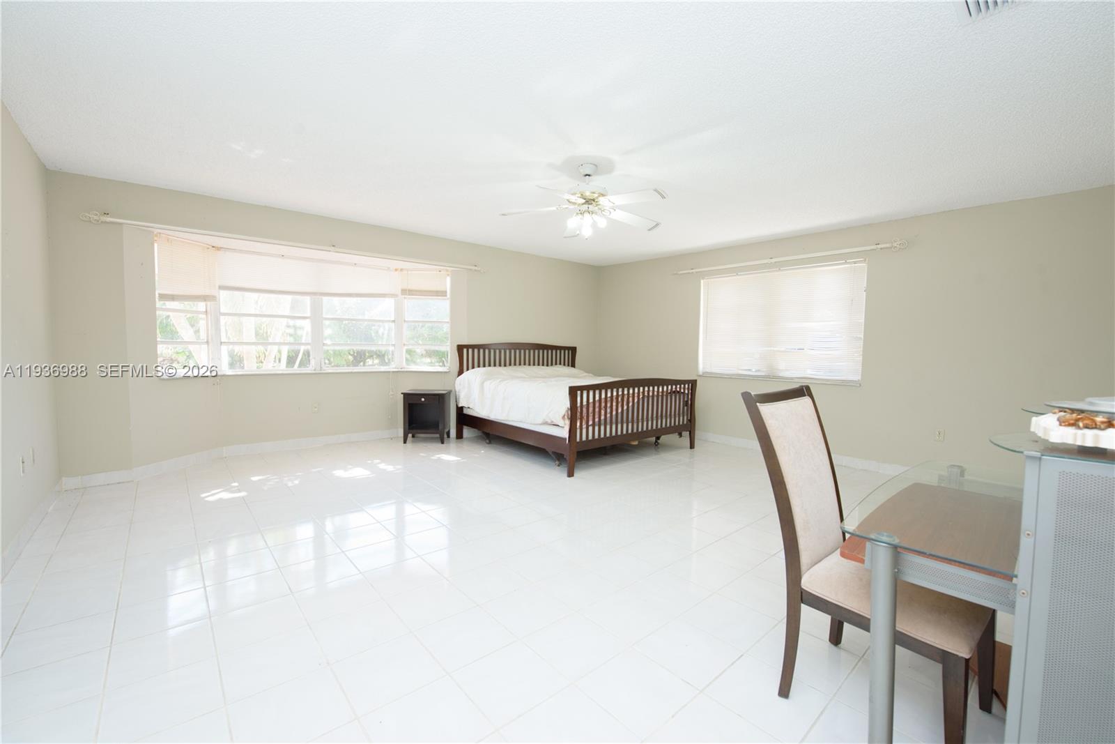 21295 Southwest 376th Street Homestead, FL 33034 - Photo 15 of 51 a living room with furniture and a window