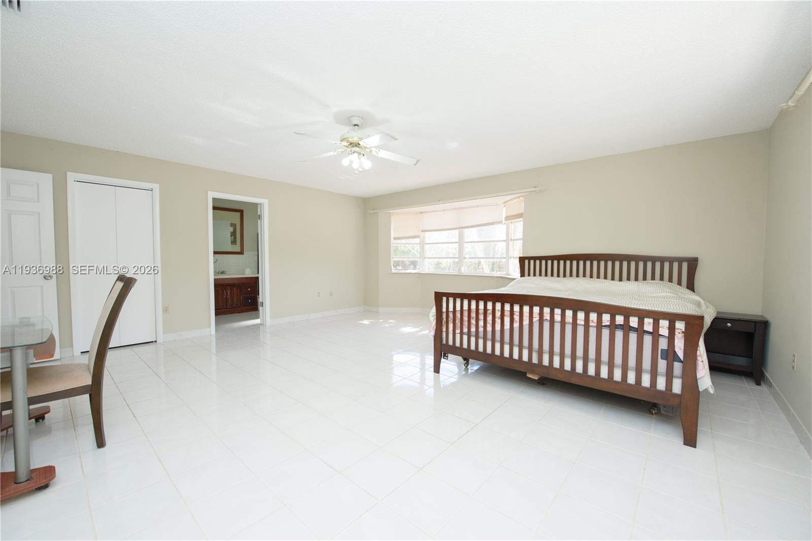 21295 Southwest 376th Street Homestead, FL 33034 - Photo 16 of 51 a bedroom with furniture and window