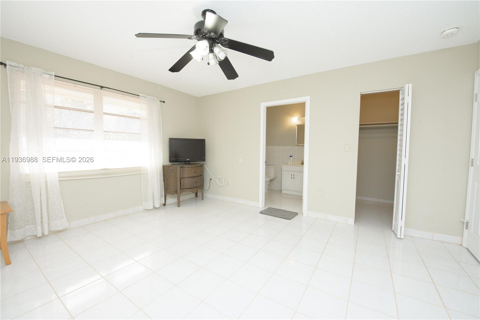 21295 Southwest 376th Street Homestead, FL 33034 - Photo 18 of 51 a view of an empty room with window and cabinet