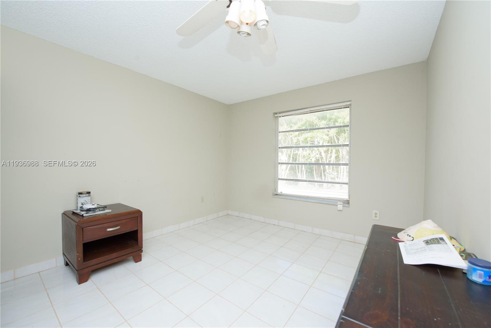 21295 Southwest 376th Street Homestead, FL 33034 - Photo 22 of 51 a living room with furniture and a window