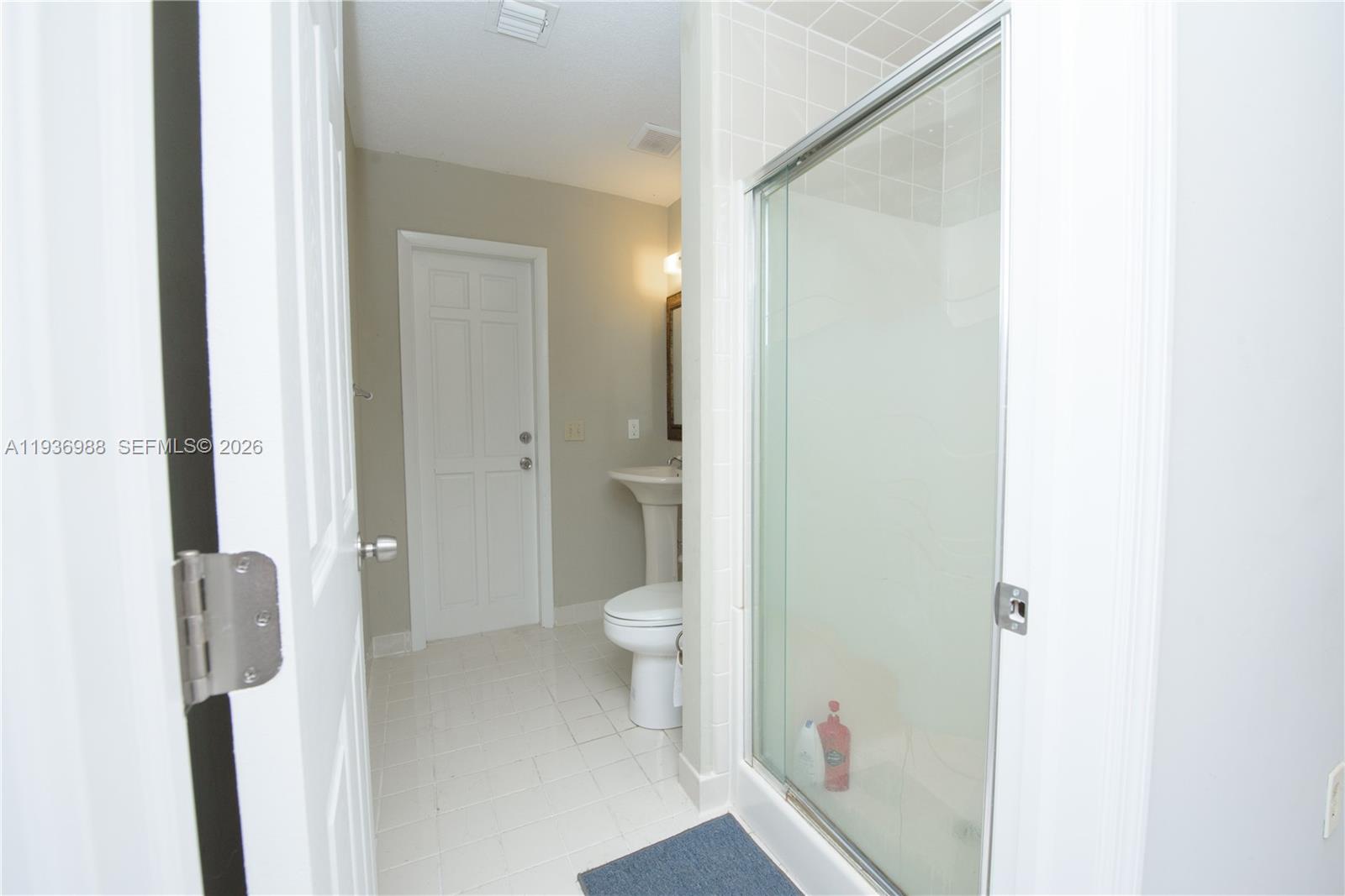 21295 Southwest 376th Street Homestead, FL 33034 - Photo 23 of 51 a bathroom with a granite countertop shower a toilet and a sink