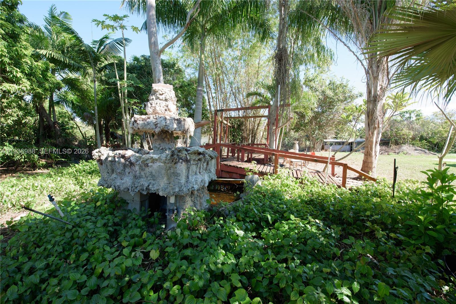 21295 Southwest 376th Street Homestead, FL 33034 - Photo 35 of 51 a garden view with a fountain
