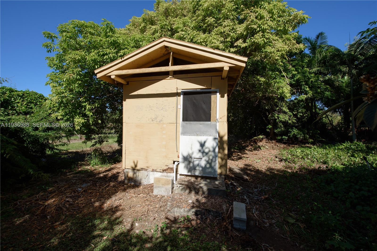 21295 Southwest 376th Street Homestead, FL 33034 - Photo 36 of 51 a front view of a house with garden