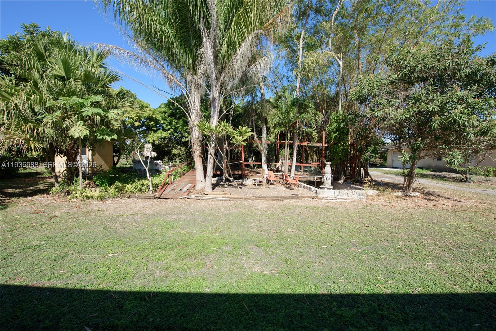 21295 Southwest 376th Street Homestead, FL 33034 - Photo 37 of 51 a view of a swimming pool with an outdoor space