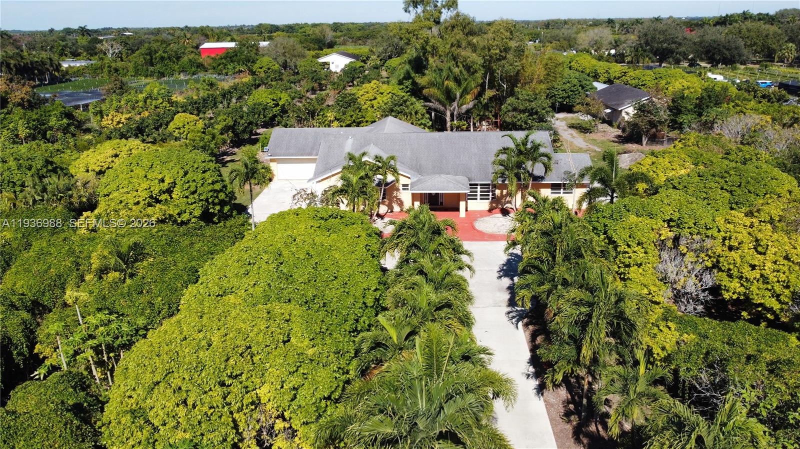 21295 Southwest 376th Street Homestead, FL 33034 - Photo 44 of 51 an aerial view of residential house with outdoor space and trees all around
