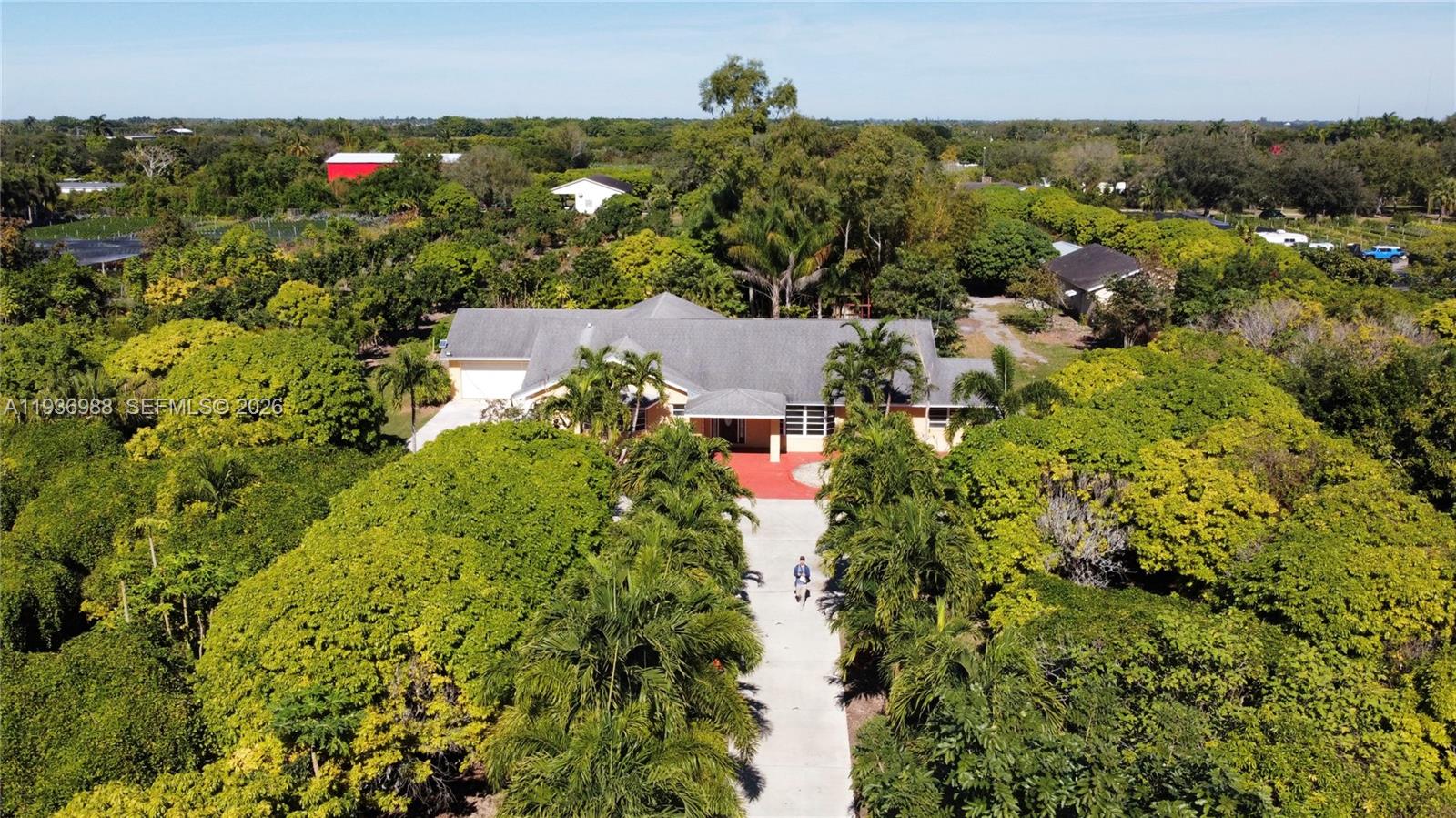 21295 Southwest 376th Street Homestead, FL 33034 - Photo 49 of 51 an aerial view of a house with a yard and lake view