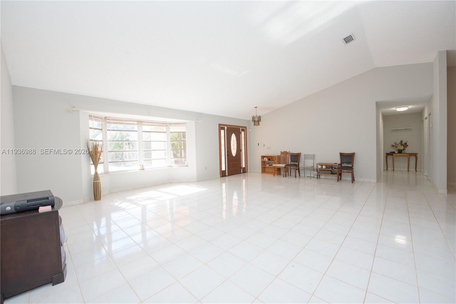 21295 Southwest 376th Street Homestead, FL 33034 - Photo 5 of 51 a view of a livingroom with furniture and a window