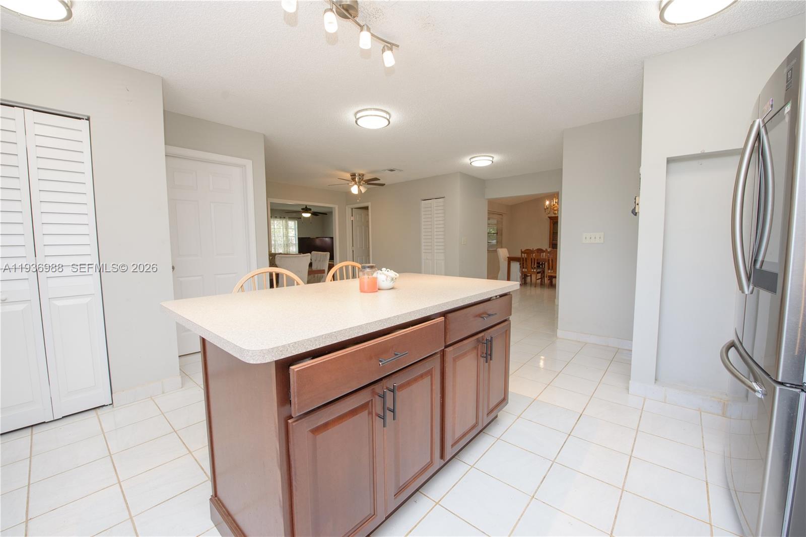 21295 Southwest 376th Street Homestead, FL 33034 - Photo 10 of 51 a bathroom with a sink a mirror and a shower