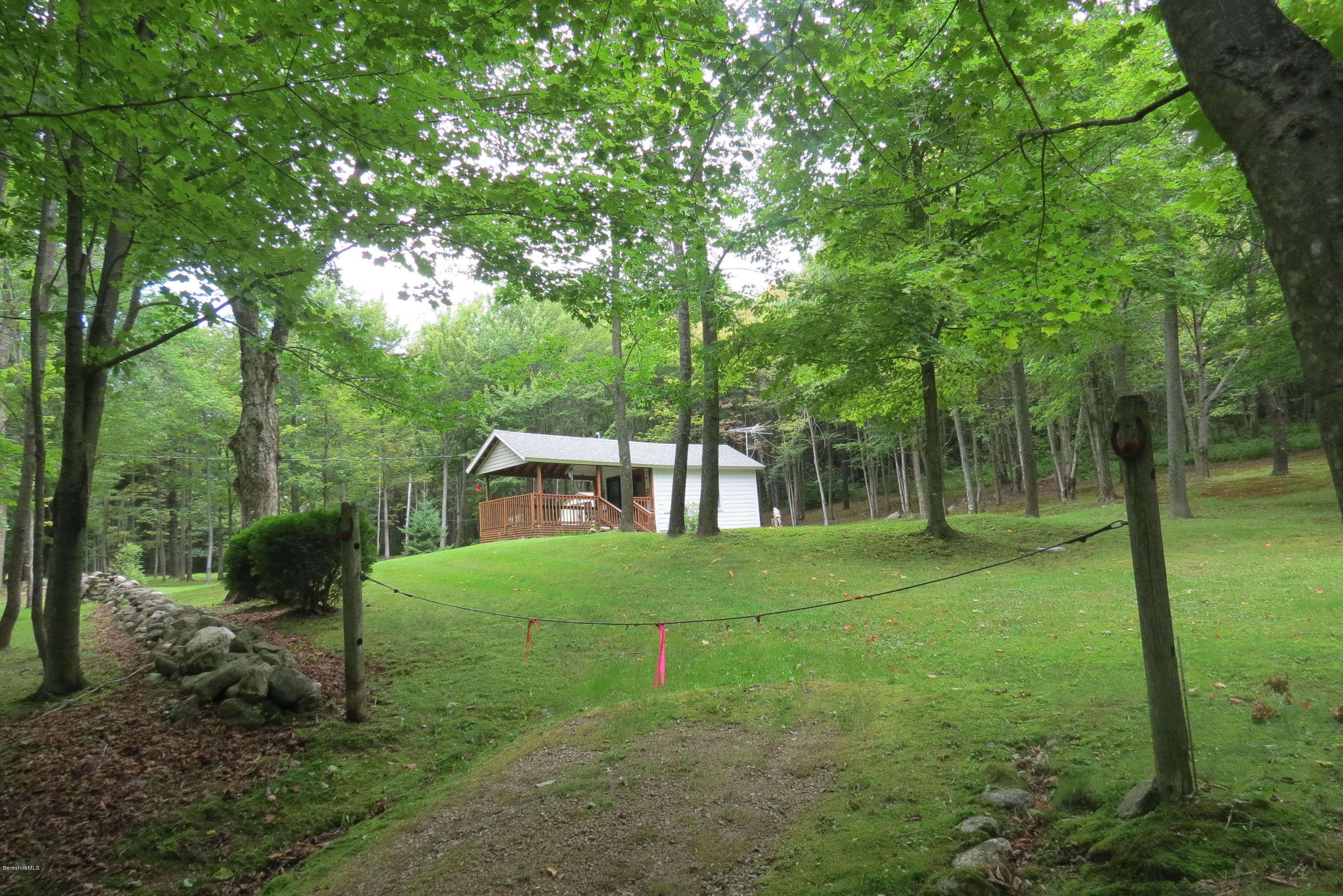 1818-2 County Road Stamford, VT 05352 - Photo 7 of 59 a view of a trees and barn in the middle of a yard